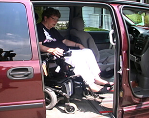 woman in wheelchair exiting van